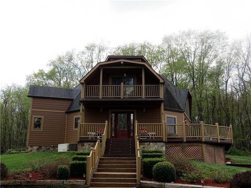 Exterior Front. Rustic elegance describes this cus