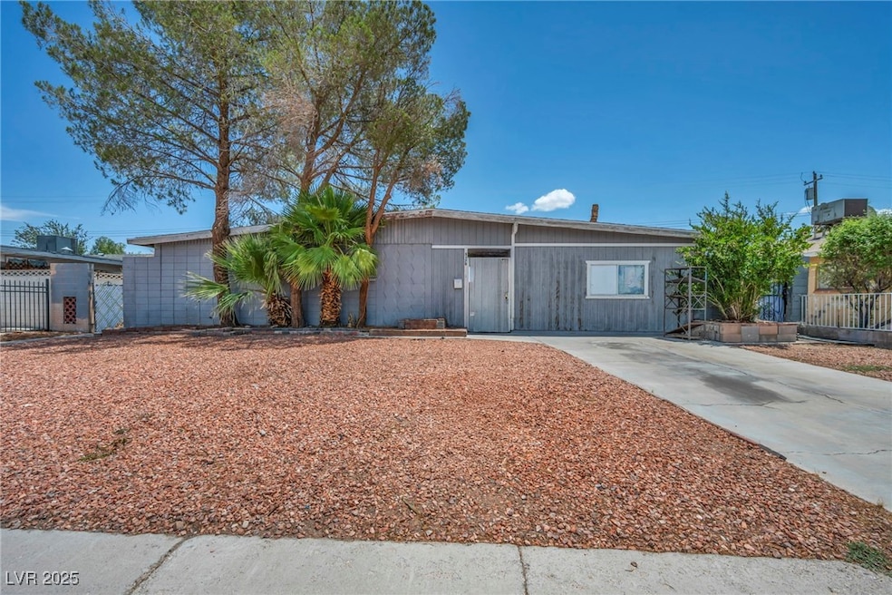 View of front of house featuring concrete driveway