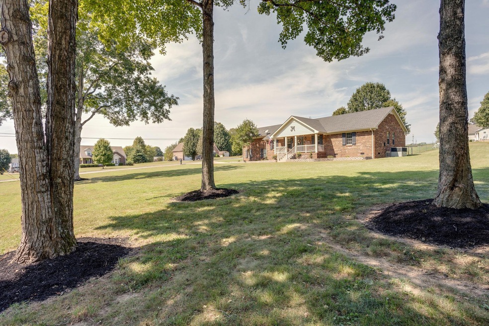 Wonderful park like mature trees on this acre plus lot! Just 5 miles to stores and interstates. Quiet great neighborhood.
