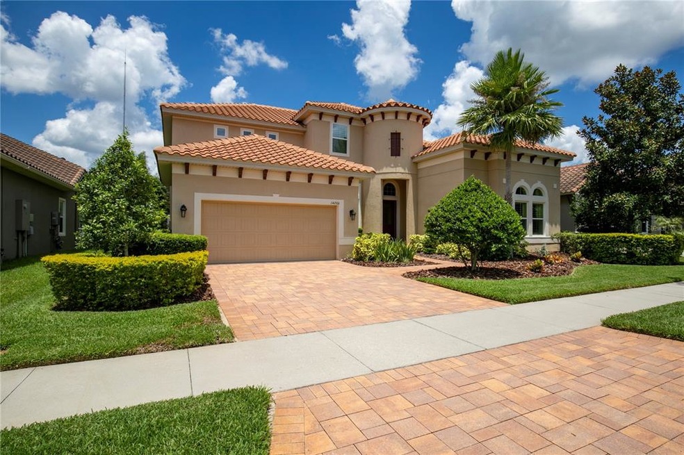 Manicured landscaping with driveway pavers