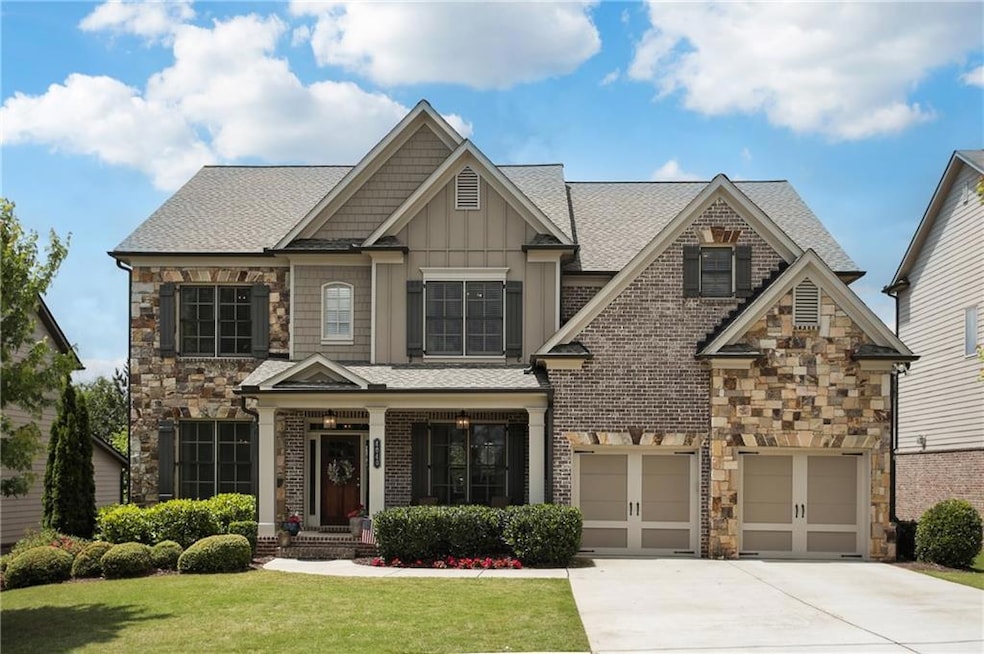 Craftsman inspired home with a garage and a front 