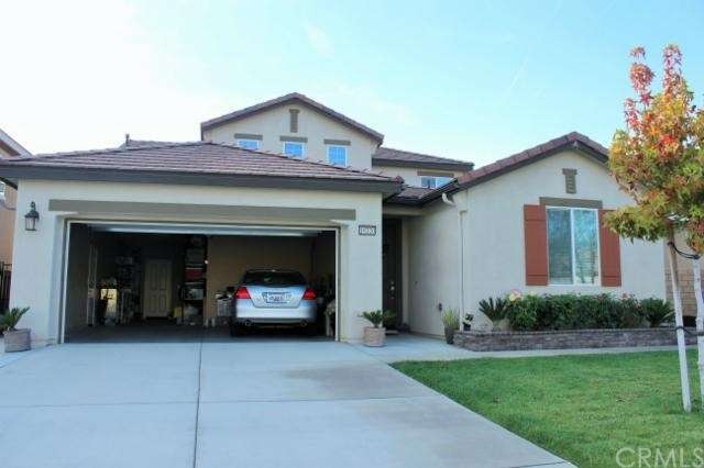 Front of Home/Showing 3 Car Tandem Garage