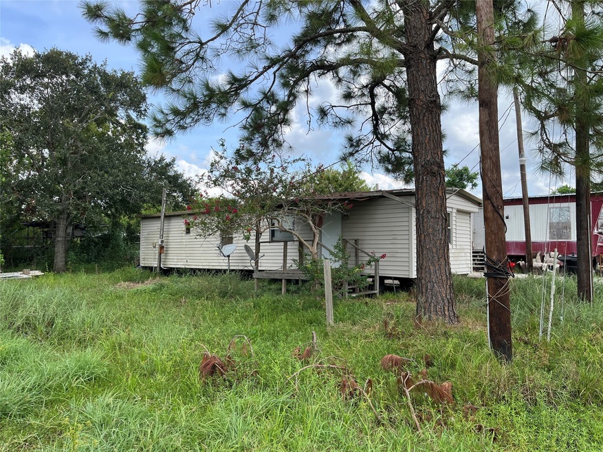 Corner lot in Pine Colony, with mature trees aroun