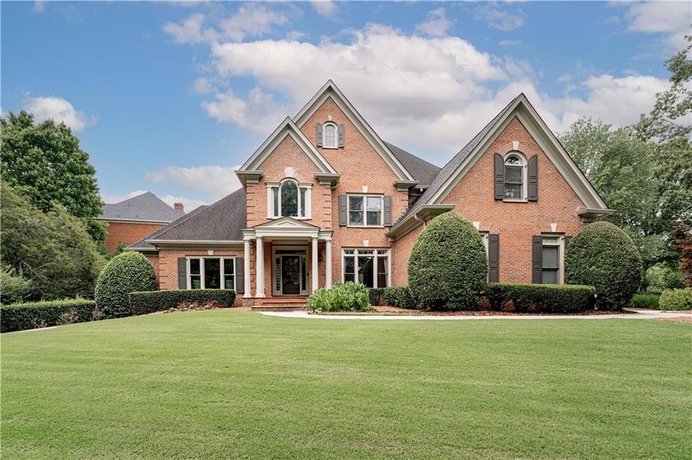 Stately brick home on large .8 acre lot in prestig