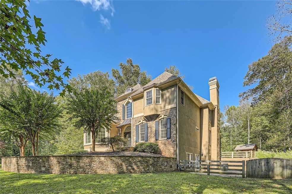 Back of house with a lawn