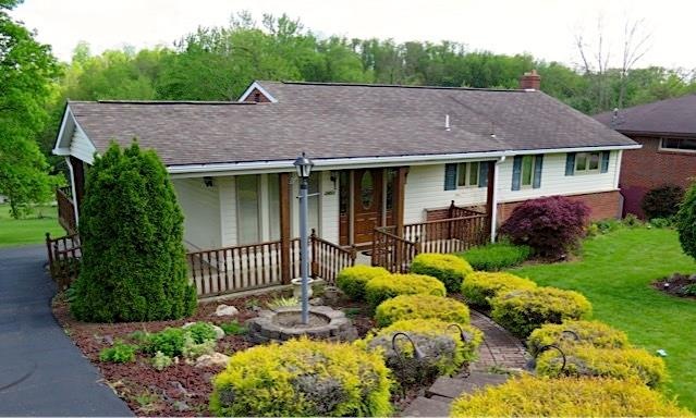 Meticulously maintained ranch home with mature lan