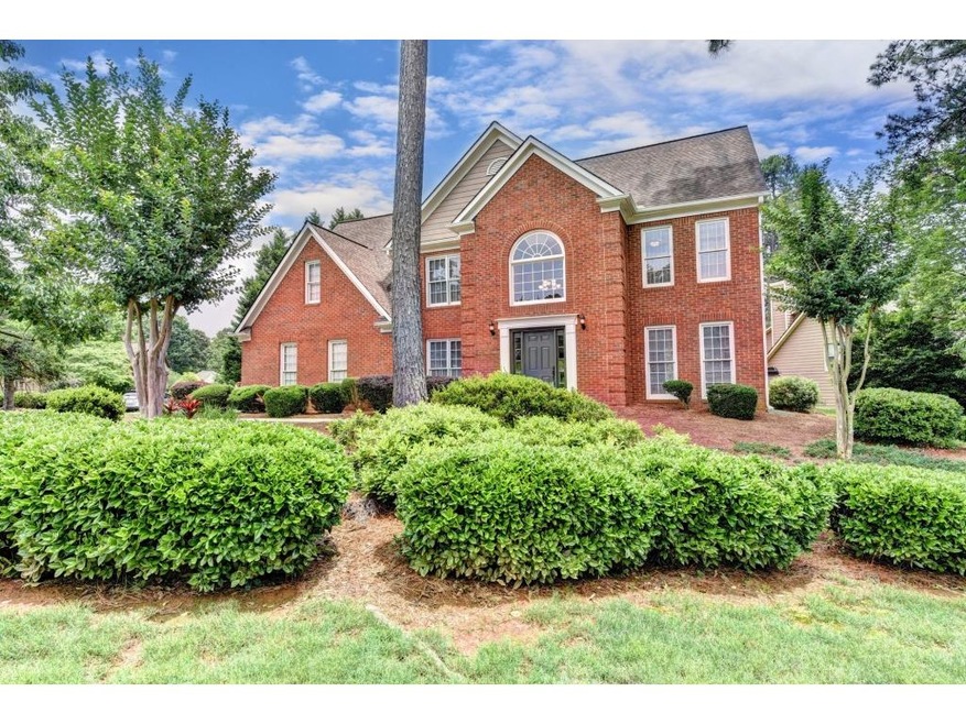 Traditionally Brick Front Home with side entry gar
