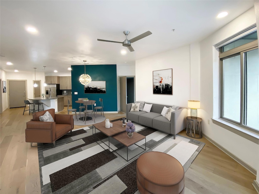 Living room with light wood-style floors, ceiling