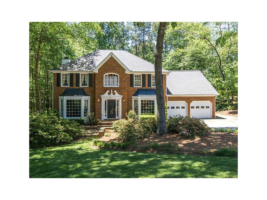 Exterior Front. Large, manicured lawn
