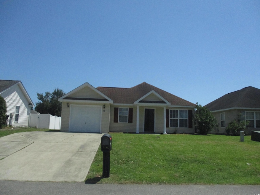 Ranch-style house with driveway and a garage
