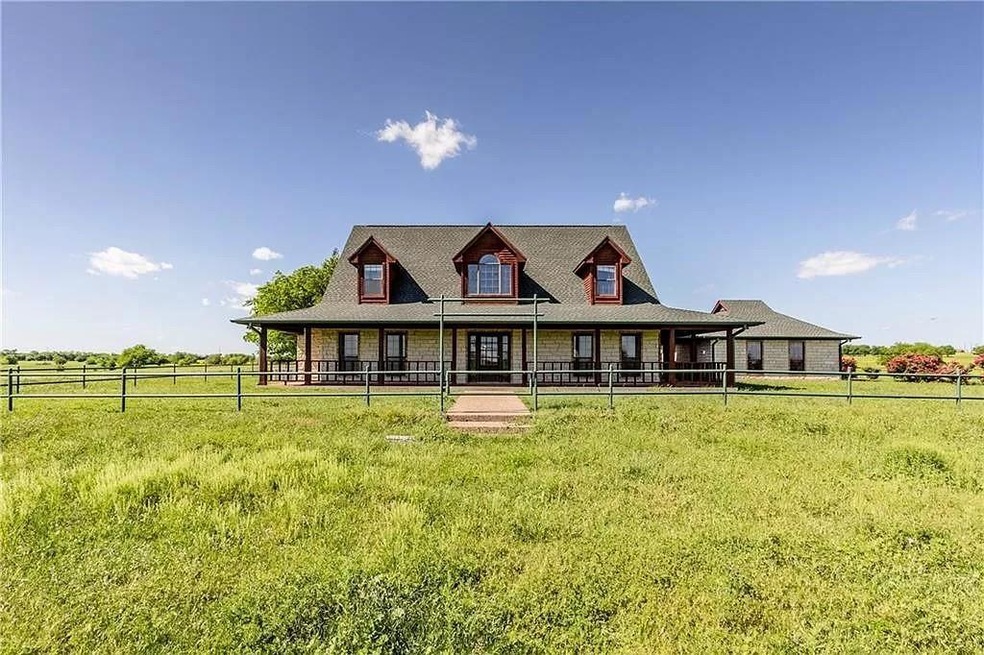 Farmhouse featuring a front yard and a porch