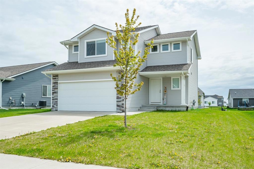 Front view of the exterior with 2 car garage