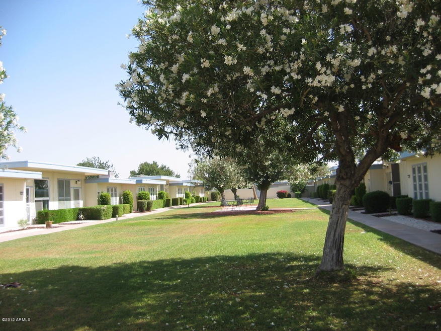Front Courtyard with grass and trees