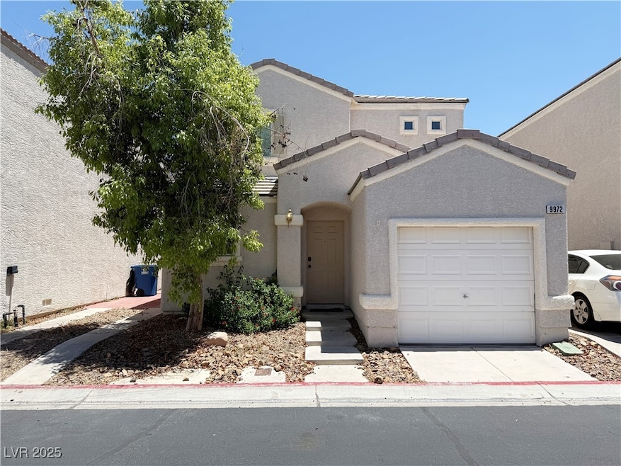 View of front of property with stucco siding, an a