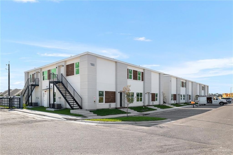 View of building exterior featuring stairway