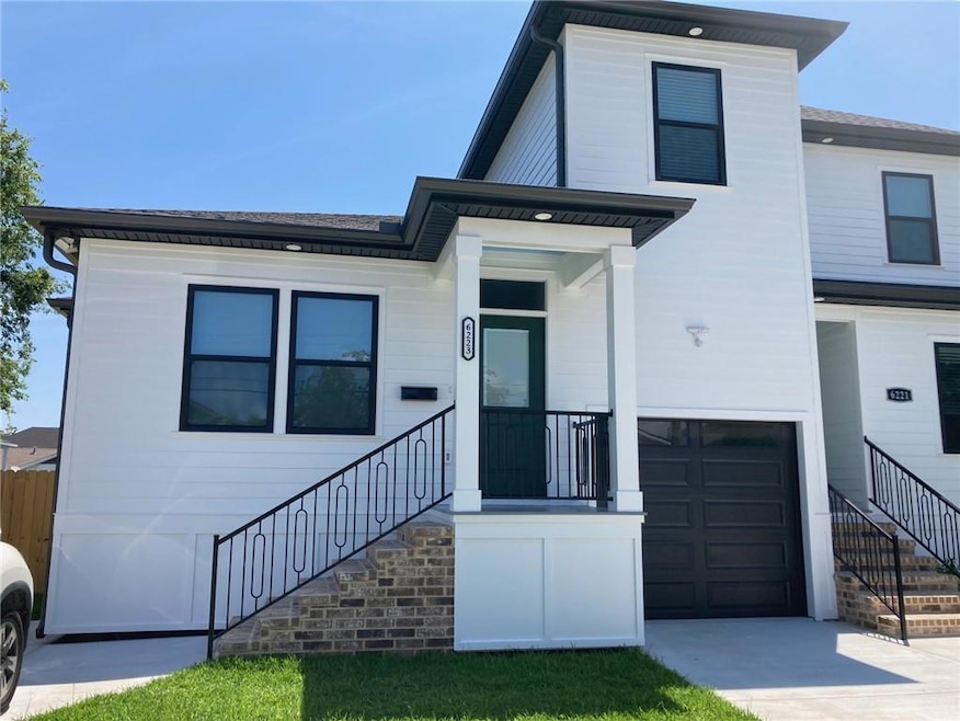 Exterior front.  Driveway is on the left side