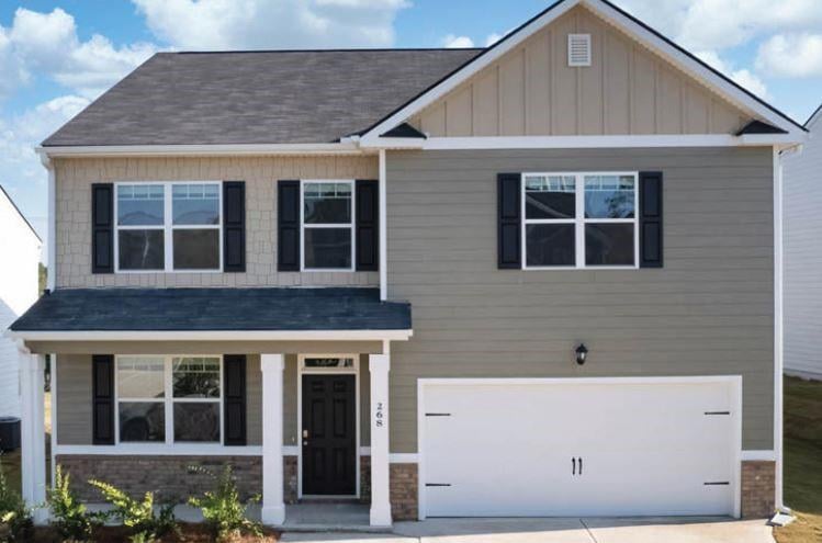 Craftsman inspired home featuring a garage
