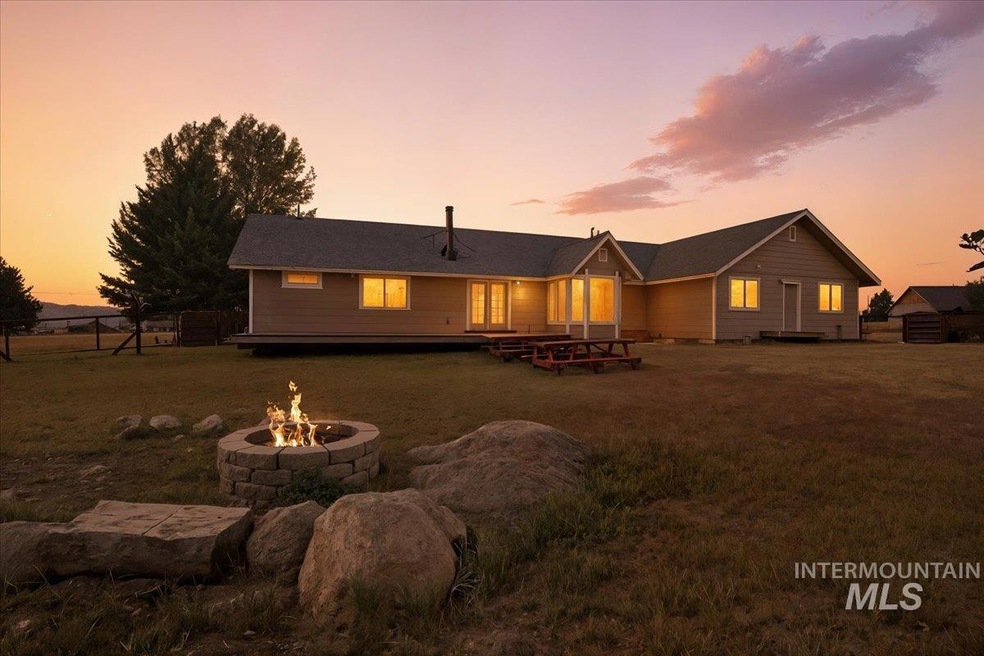 Rear view of house with a fire pit