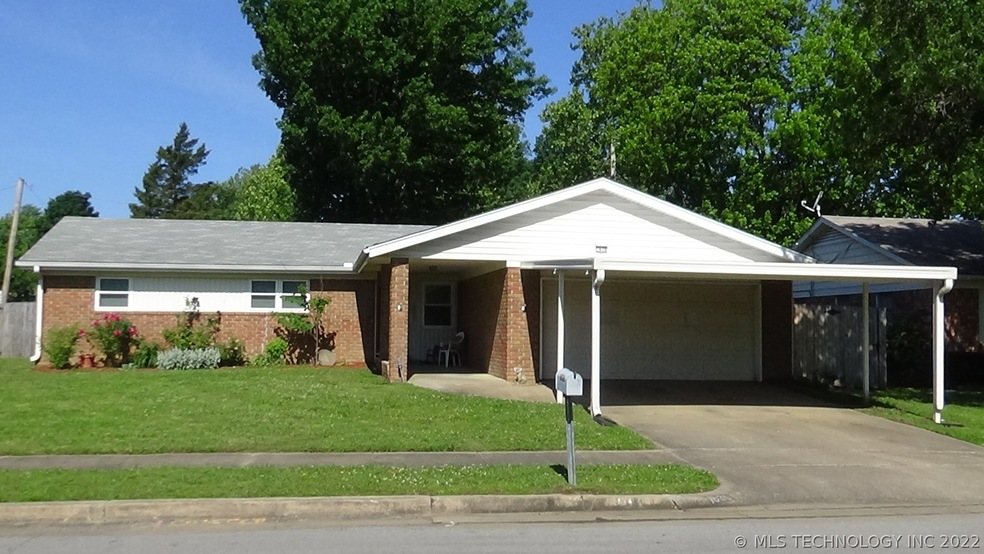 2 car garage with door opener PLUS a 2 car carport