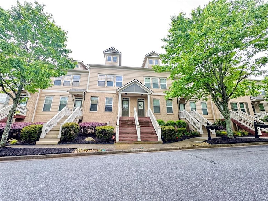 View of property with stairs