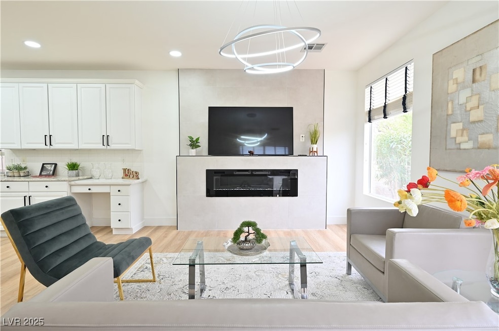 Living area featuring recessed lighting, visible v
