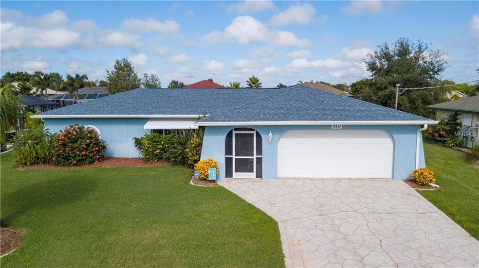 Exterior front of home. Two car garage , new roof,