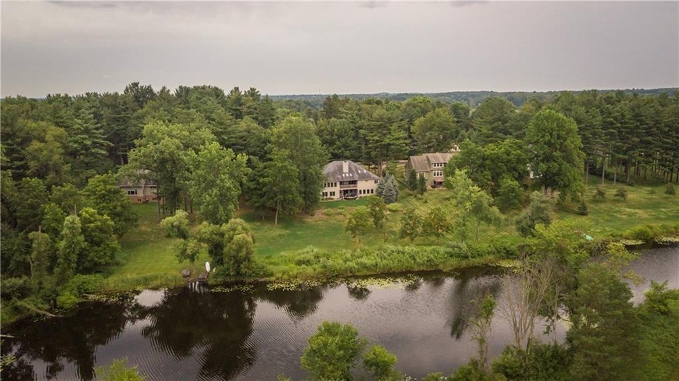 Nestled among mature trees with a great water view