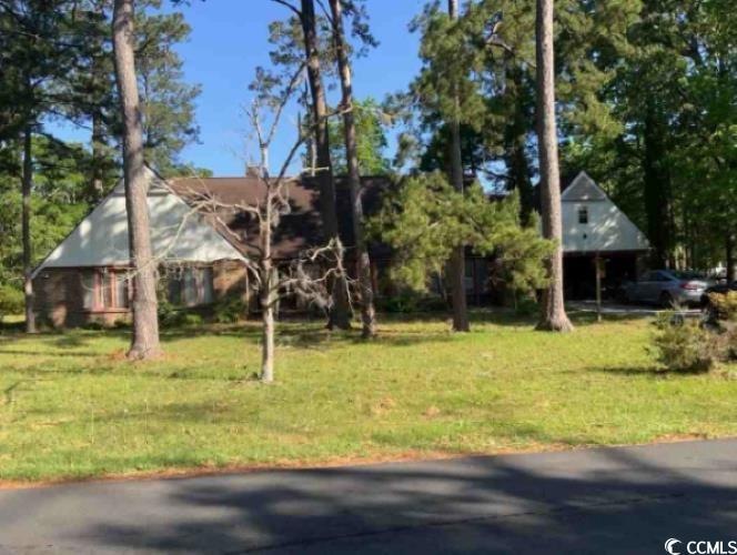 View of front of home featuring a front lawn