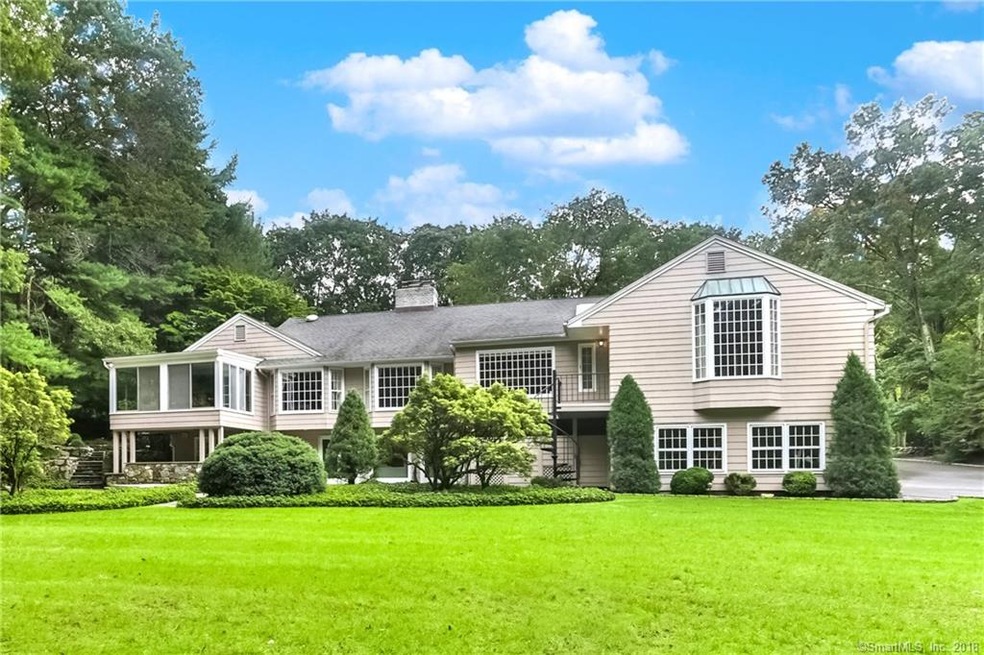 Rear of the house with beautiful back yard.