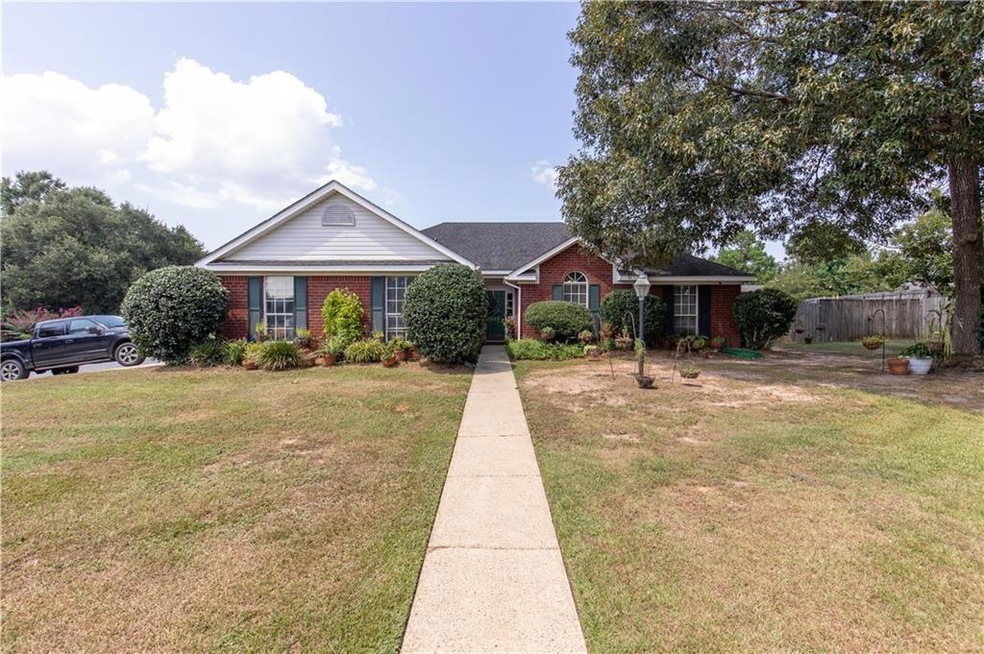 Single story home with a front lawn