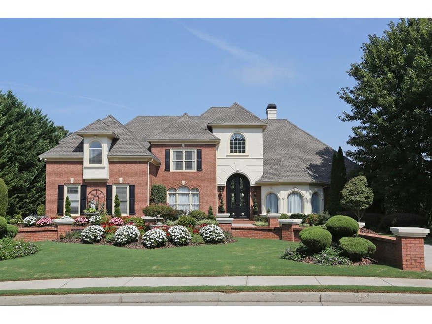 Beautiful front view of home with circular drive.