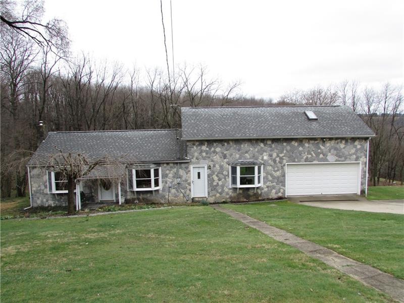 Front exterior stone. with 2 car garage. Concrete 