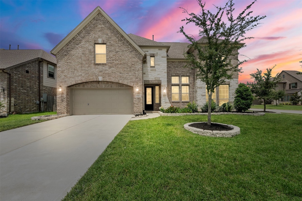 Welcome home to this stunning brick and stone elev