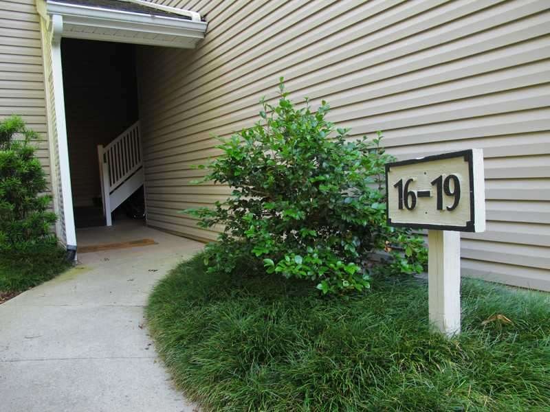 Exterior Front. Convenient, stepless covered groun
