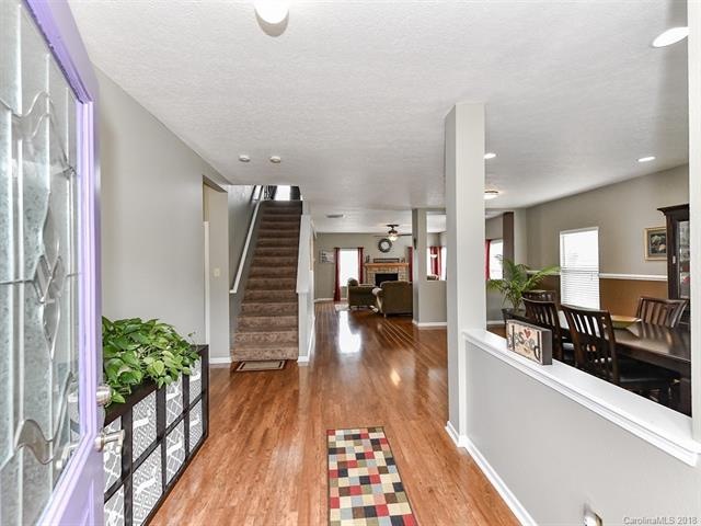 Beautiful wood floors great you in the foyer.