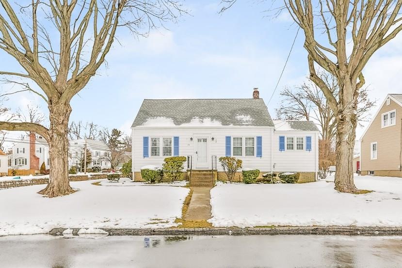 Charming corner lot cape with cedar shingle siding