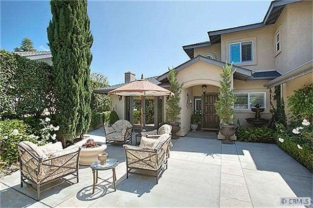 Welcoming entry with fountain and firepit.