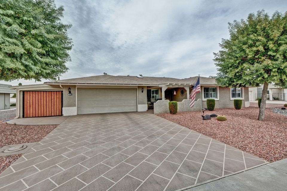 STUCCOES HOME WITH GOLF CART STORAGE