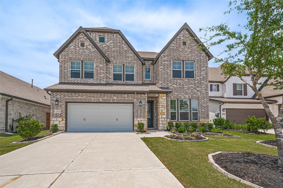 Stunning curb appeal with a classic brick and ston
