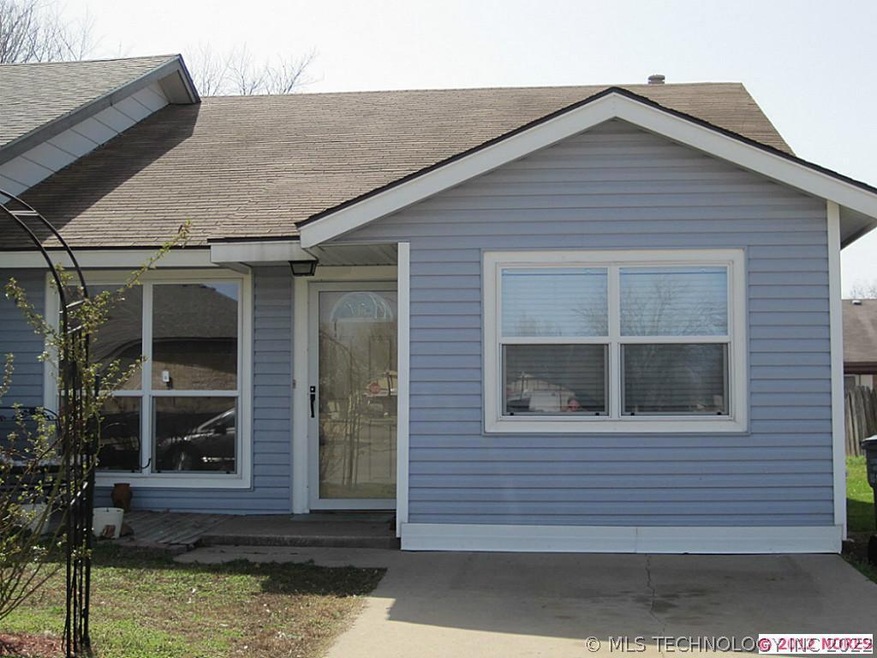 Cozy home with vinyl siding, laminate flooring and