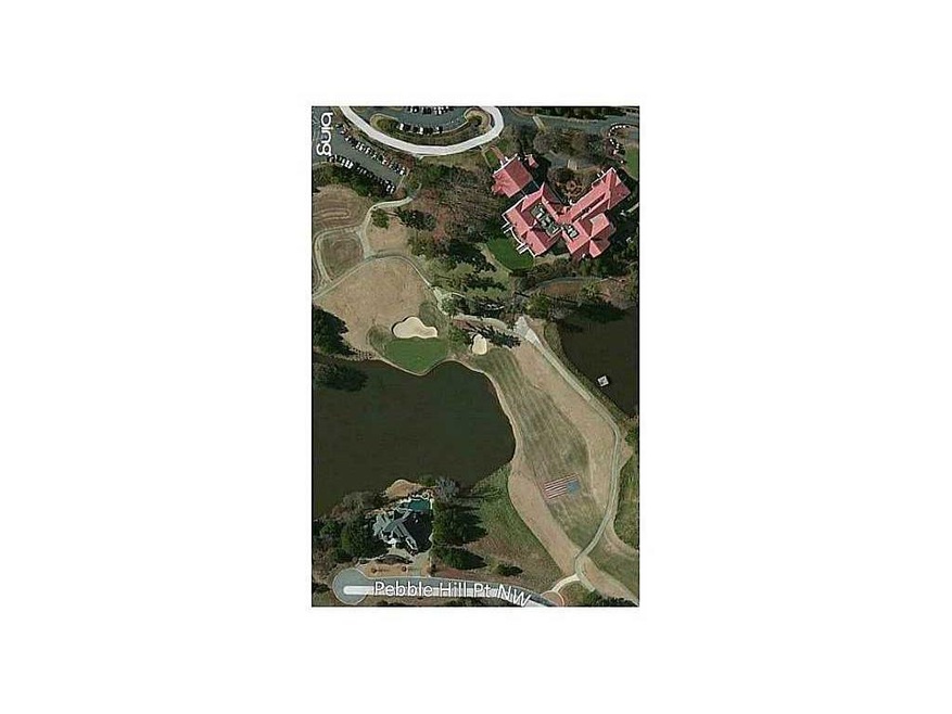 Exterior Front. Aerial view of lot, 18th green, la