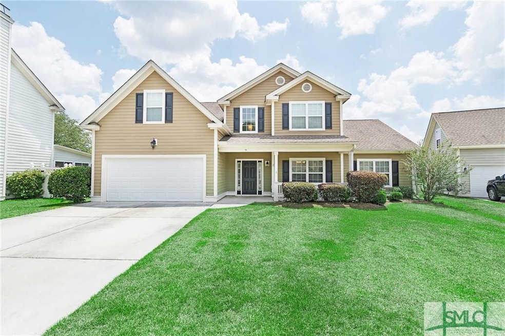 Home front with mature landscaping.
