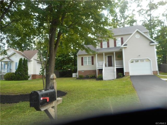 Front view of the house showing garage and front p