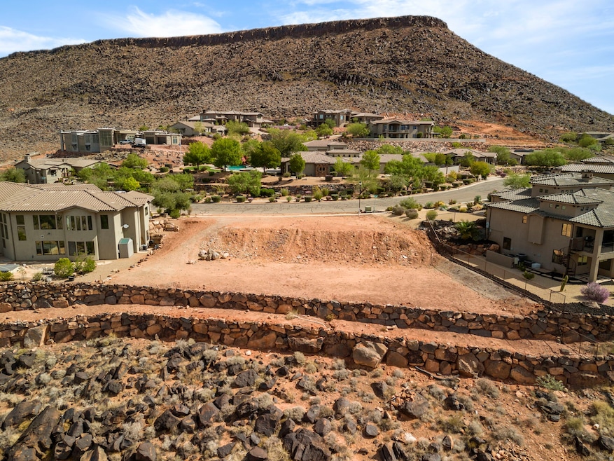 View of mountain backdrop featuring nearby suburban area