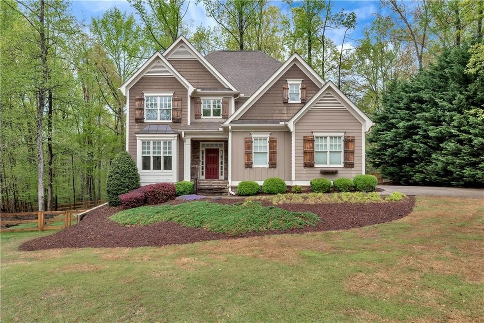 Craftsman-style house featuring a front yard