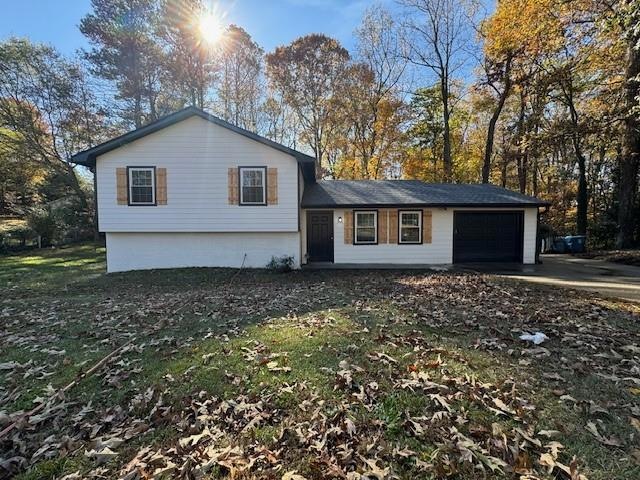 View of front of property with a garage