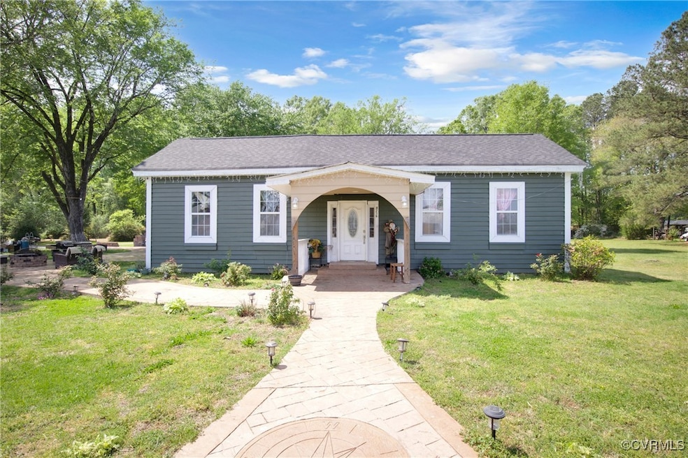View of front of property featuring roof with shin