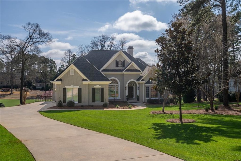 Craftsman-style home with a front lawn and covered