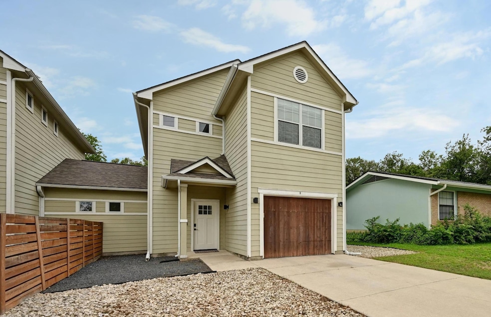 Traditional-style house with concrete driveway an