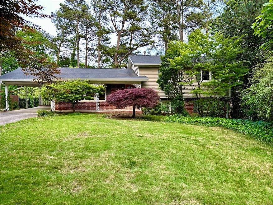 View of front of home featuring a carport and a fr
